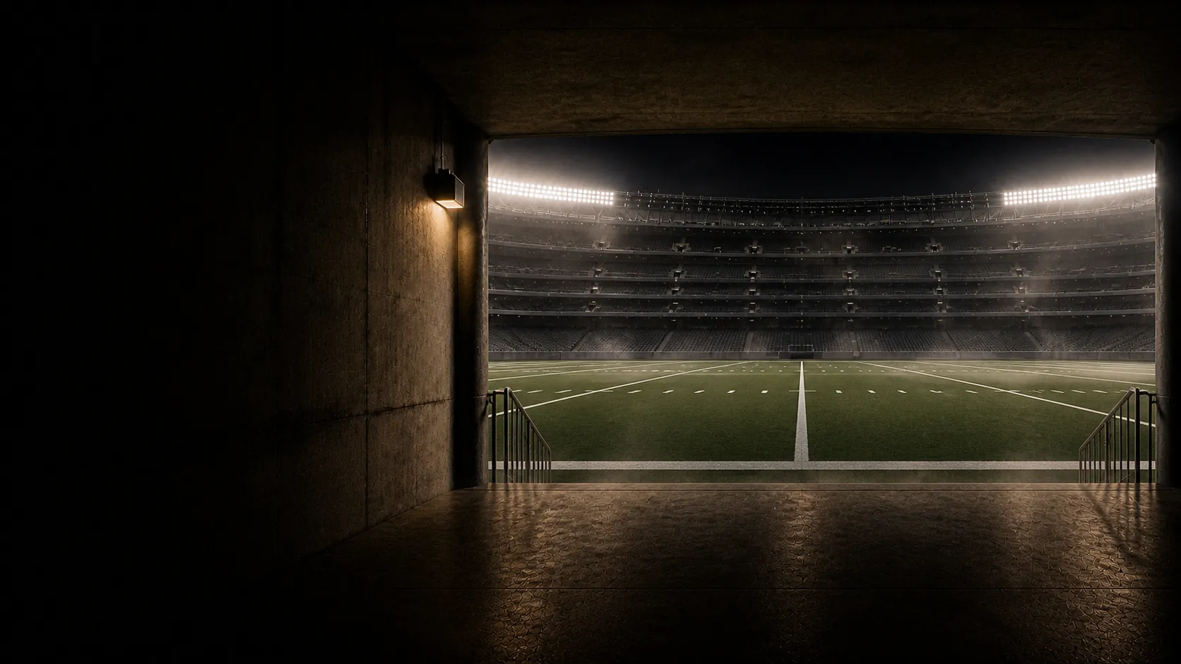 An empty football stadium viewed from the tunnel